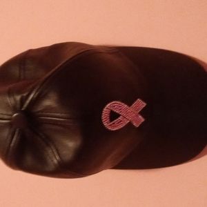 Vera New York faux black leather cap with pink and clear cancer rhinestones